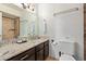 Elegant bathroom features granite countertops, vanity with sink, and a tiled shower, combining style and functionality at 8055 E Thomas Rd # B208, Scottsdale, AZ 85251