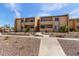 Multi-level apartment building with walkway and desert landscaping at 8055 E Thomas Rd # B208, Scottsdale, AZ 85251