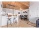 Kitchen with breakfast bar seating, dining area, and a wood vaulted ceiling at 8055 E Thomas Rd # B208, Scottsdale, AZ 85251