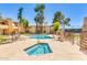 Community pool and hot tub, surrounded by lounge chairs and desert landscaping at 8055 E Thomas Rd # B208, Scottsdale, AZ 85251