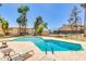 A community pool with plenty of lounge seating and a clear blue sky above at 8055 E Thomas Rd # B208, Scottsdale, AZ 85251