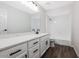 Bright bathroom featuring double sinks, large vanity, and white tile shower at 8443 E Via De Los Libros --, Scottsdale, AZ 85258