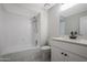 Clean bathroom featuring a shower-tub combo and vanity with white cabinets at 8443 E Via De Los Libros --, Scottsdale, AZ 85258
