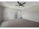 Spacious bedroom with a ceiling fan and neutral gray carpet at 8443 E Via De Los Libros --, Scottsdale, AZ 85258