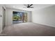 Bright bedroom featuring neutral paint, plush carpeting, and a large window overlooking the yard at 8443 E Via De Los Libros --, Scottsdale, AZ 85258
