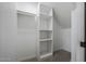 White, well-organized walk-in closet with carpet floors at 8443 E Via De Los Libros --, Scottsdale, AZ 85258
