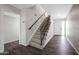 Inviting entryway with wood-look floors and a staircase with decorative wrought iron railing at 8443 E Via De Los Libros --, Scottsdale, AZ 85258