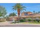 Charming home featuring desert landscaping, mature palm trees, and a two-car garage at 8443 E Via De Los Libros --, Scottsdale, AZ 85258