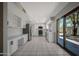 Expansive kitchen features stainless steel appliances, white cabinetry, and a peninsula island at 8443 E Via De Los Libros --, Scottsdale, AZ 85258