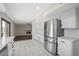 Updated kitchen with stainless steel appliances and a slider leading to the backyard at 8443 E Via De Los Libros --, Scottsdale, AZ 85258