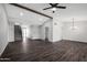 Spacious living room featuring light walls, wood floors, and neutral fixtures at 8443 E Via De Los Libros --, Scottsdale, AZ 85258