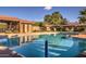 Inviting community pool surrounded by lounge chairs and shaded tables for relaxation and leisure at 8443 E Via De Los Libros --, Scottsdale, AZ 85258