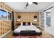 Bright bedroom features hardwood floors, natural light and unique animal print wallpaper at 8707 E Clarendon Ave, Scottsdale, AZ 85251