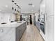 Bright and modern kitchen with a center island, marble countertop, pendant lights, and stainless steel appliances at 8707 E Clarendon Ave, Scottsdale, AZ 85251