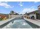 Backyard featuring a pool, a mural on the privacy wall, and outdoor seating and grill at 8707 E Clarendon Ave, Scottsdale, AZ 85251