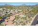 Aerial view showcasing the community, pool, and surrounding desert landscape at 8880 E Paraiso Dr # 118, Scottsdale, AZ 85255