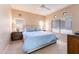 Spacious bedroom with large windows, neutral walls, carpet and ceiling fan at 8880 E Paraiso Dr # 118, Scottsdale, AZ 85255
