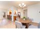Bright dining area featuring a pass-through bar to the kitchen with great lighting at 8880 E Paraiso Dr # 118, Scottsdale, AZ 85255