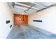 Spacious two-car garage featuring built-in cabinets and ample storage space at 8880 E Paraiso Dr # 118, Scottsdale, AZ 85255