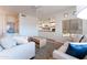Bright living room features a built-in entertainment center, ceiling fan and neutral color palette at 8880 E Paraiso Dr # 118, Scottsdale, AZ 85255