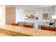 Stylish living room featuring built-in shelving, a large flat-screen TV, and comfortable seating at 8880 E Paraiso Dr # 118, Scottsdale, AZ 85255