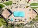 Overhead view of a community pool with lounge chairs and umbrellas offering a relaxing retreat at 8880 E Paraiso Dr # 118, Scottsdale, AZ 85255