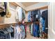 Walk-in closet with built-in shelving and rod system for maximum storage at 8880 E Paraiso Dr # 118, Scottsdale, AZ 85255