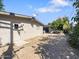 This backyard offers an expansive, shaded area, a small shed, and a satellite dish at 1219 E Colter St # 8, Phoenix, AZ 85014