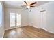 This bedroom features sleek floors, double doors to the outside, and a closet for storage at 1219 E Colter St # 8, Phoenix, AZ 85014