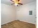 Bright bedroom featuring wood-look flooring, a ceiling fan, and a double door closet at 1219 E Colter St # 8, Phoenix, AZ 85014