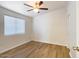 Bright bedroom featuring wood-look flooring, a ceiling fan, and natural light at 1219 E Colter St # 8, Phoenix, AZ 85014