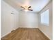 Bright bedroom featuring wood-look flooring, a ceiling fan, and a double door closet and lots of light at 1219 E Colter St # 8, Phoenix, AZ 85014