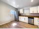 Bright kitchen features stainless appliances, wood-look floors and white cabinets at 1219 E Colter St # 8, Phoenix, AZ 85014