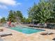 Community swimming pool with lounge chairs, umbrellas, and well maintained common areas at 1219 E Colter St # 8, Phoenix, AZ 85014