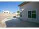 Tiled patio with inviting backyard pool, offering a private oasis for leisure and entertainment at 12205 N 41St Ln, Phoenix, AZ 85029