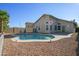 Sparkling backyard pool surrounded by desert landscaping and a secure privacy fence at 12205 N 41St Ln, Phoenix, AZ 85029