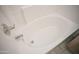 An alcove bathtub featuring white tile surround and chrome fixtures at 12205 N 41St Ln, Phoenix, AZ 85029