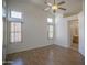 Bright and airy bedroom with wood floors, vaulted ceilings, and multiple windows for natural light at 12205 N 41St Ln, Phoenix, AZ 85029