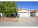 Attractive single-story home with a well-manicured front yard and attached two-car garage at 12205 N 41St Ln, Phoenix, AZ 85029