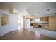 Open-concept living area with a spacious kitchen featuring ample cabinet space at 12205 N 41St Ln, Phoenix, AZ 85029