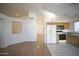 Open-concept kitchen and living area with great natural light and modern appliances at 12205 N 41St Ln, Phoenix, AZ 85029