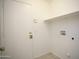 Utility area features laundry hookups and a door for access at 12205 N 41St Ln, Phoenix, AZ 85029