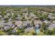 Aerial view of a neighborhood with lush landscaping, backyard pools, and mature trees throughout the community at 1379 S Claiborne Ave, Gilbert, AZ 85296
