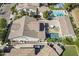 Aerial view of home featuring a backyard pool and spa, outdoor seating, fire pit, and mature landscaping at 1379 S Claiborne Ave, Gilbert, AZ 85296