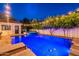 Beautiful backyard featuring a pool, hot tub, lounge chairs, and manicured landscaping for relaxation at 1379 S Claiborne Ave, Gilbert, AZ 85296