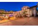 Relaxing backyard featuring a pool, fire pit, grill and a bar, perfect for outdoor entertaining and lounging at 1379 S Claiborne Ave, Gilbert, AZ 85296