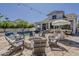 Spacious backyard with a pool, fire pit, outdoor bar, and comfortable seating, great for gatherings at 1379 S Claiborne Ave, Gilbert, AZ 85296
