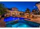 Backyard oasis featuring a sparkling pool, spa, outdoor bar, and fire pit with inviting seating at 1379 S Claiborne Ave, Gilbert, AZ 85296