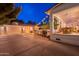 Beautiful backyard with covered patio, outdoor kitchen, and well-lit garage perfect for entertaining at 1379 S Claiborne Ave, Gilbert, AZ 85296