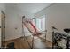 Bright bedroom features a basketball game, window, door and drum set at 1379 S Claiborne Ave, Gilbert, AZ 85296